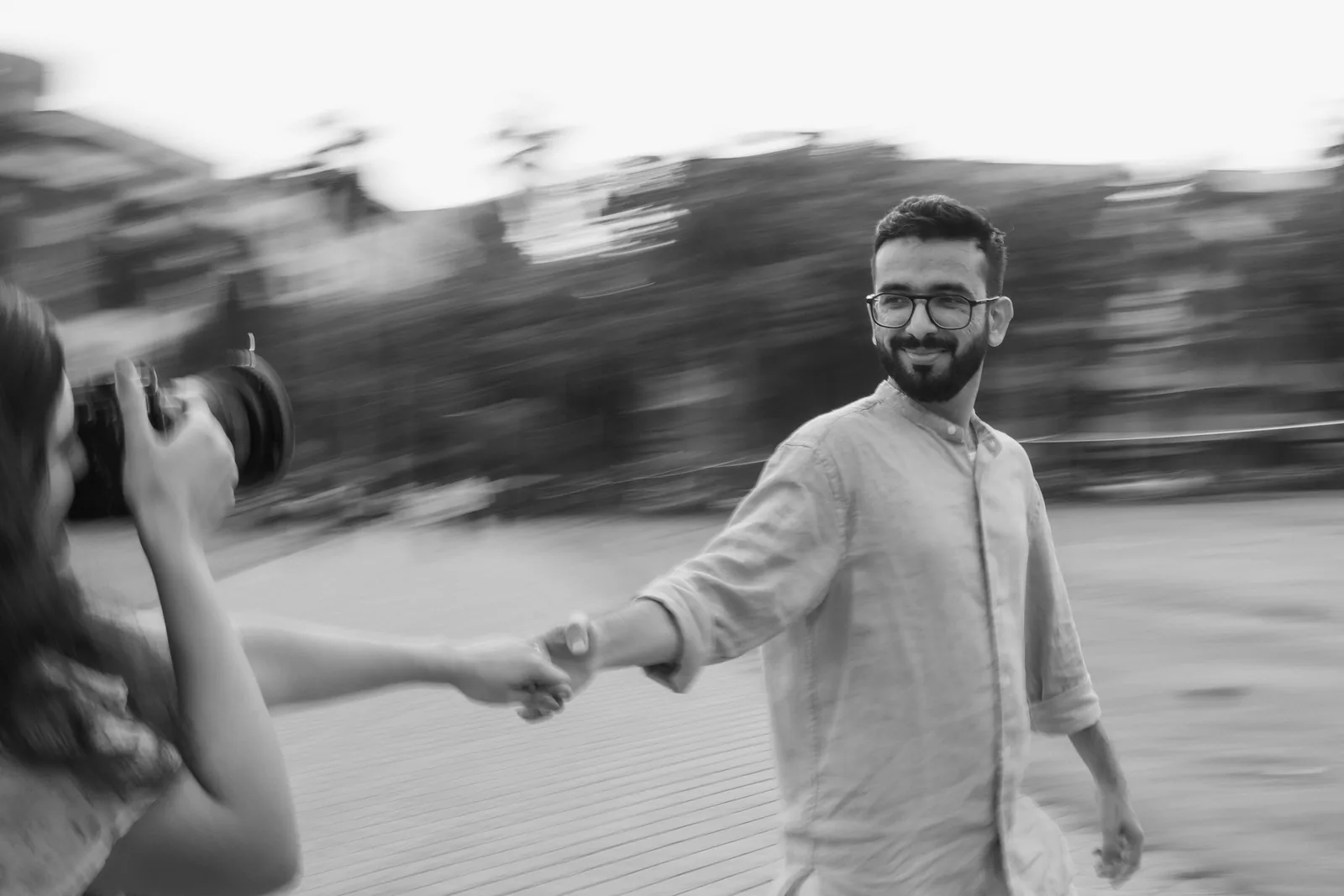 Black-and-white: she leads him by the hand