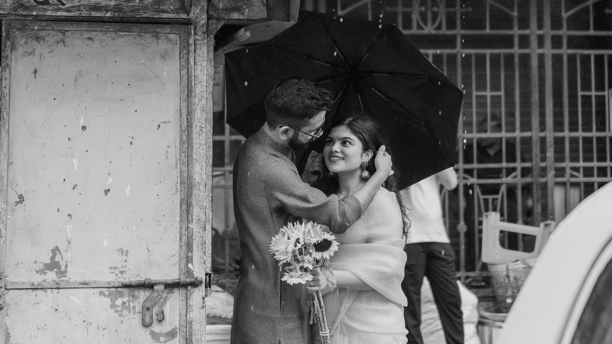 Black-and-white: under an umbrella in the monsoon