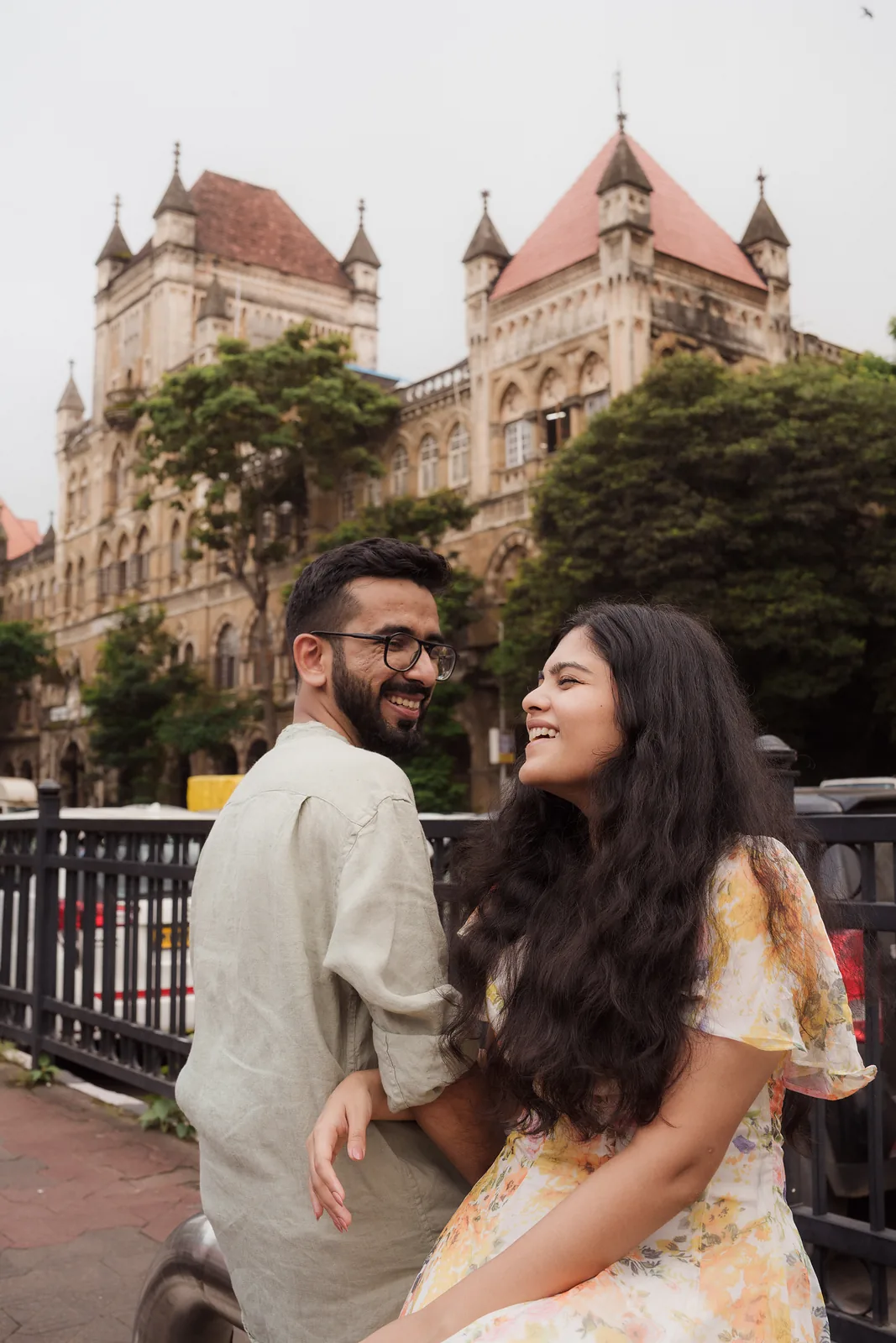 Laughing in front of a Gothic heritage building